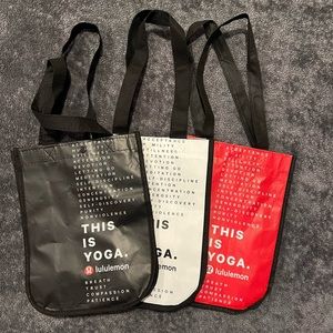 Lululemon shopping bags. Small. No tears or rips. Three (black, white and red).